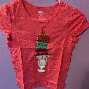 Pink T-shirt was sparkly ice cream cones